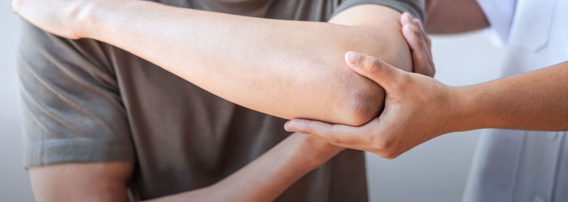 Image of someone treating a sore elbow